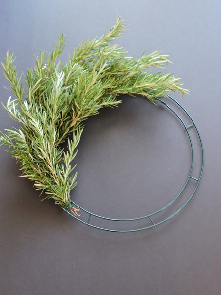 middle stage of rosemary wreath being made
