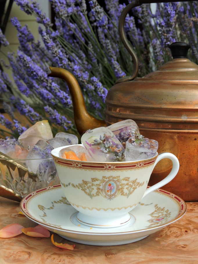 tea cup garden setting in front of lavender bush