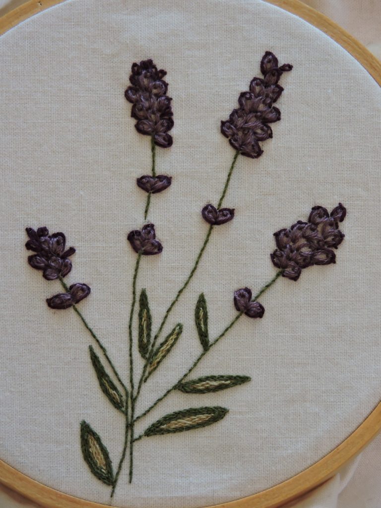 close up of embroidered lavender flowers