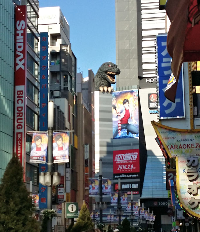 Godzilla head above building in Shinjuku