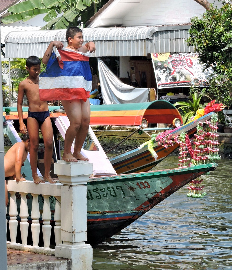 kids playing and swiming in the canals