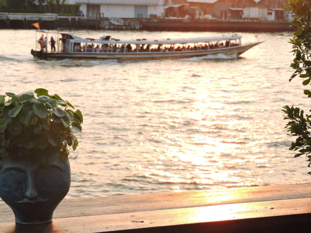 sunsetting over the chao phraya river