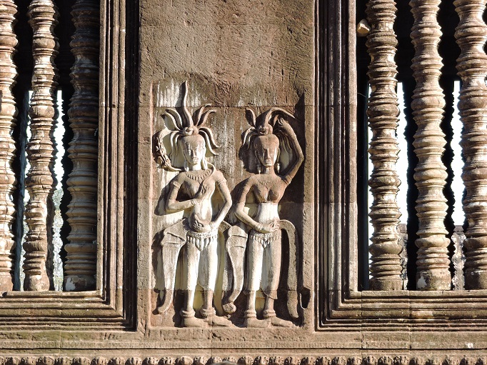 carved relief artwork of figures with headdress