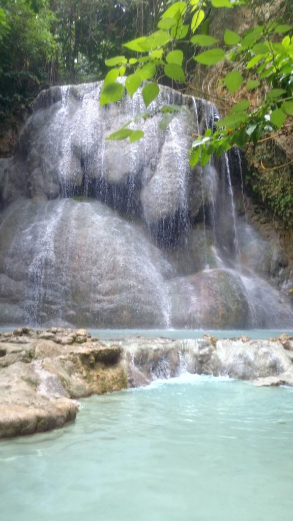 middle level Aguinid falls with bulbous rock formations and blue white water