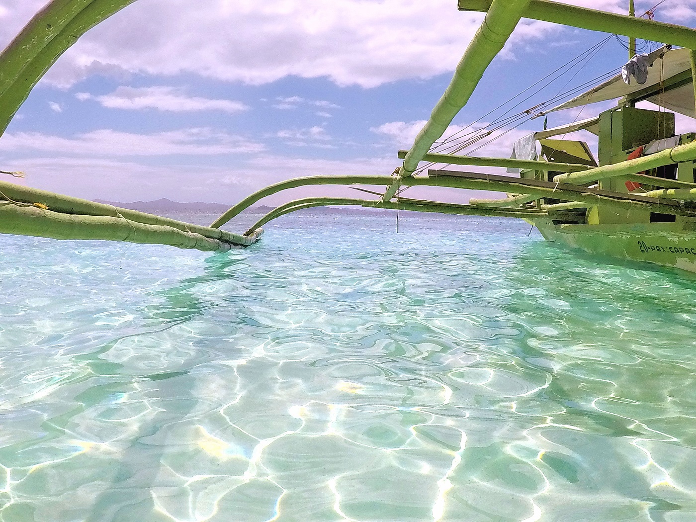 boat skiming aqua clear water