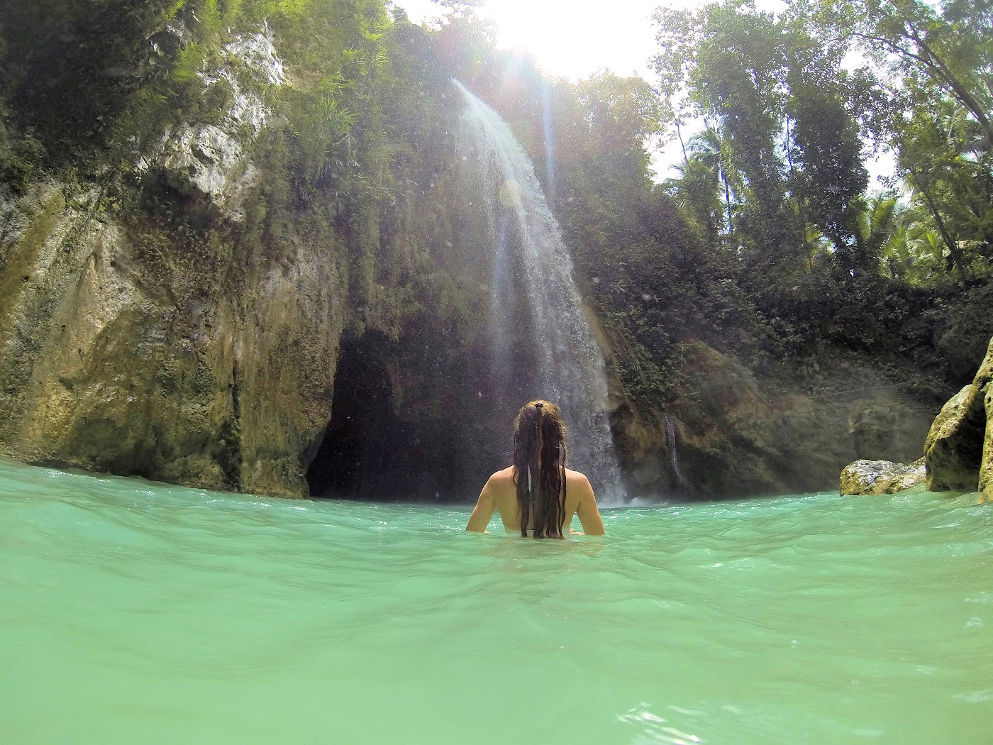 swiming in the green blue falls of jungle Inambakan
