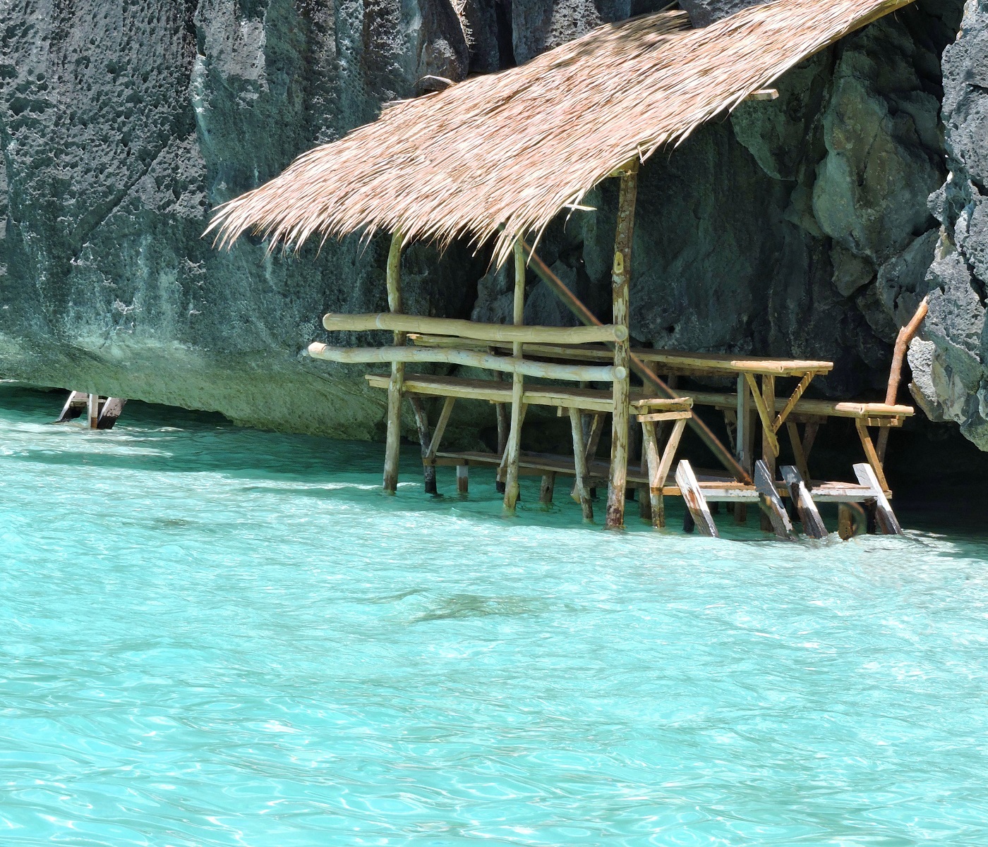 hut over light blue water in Coron Phillipine islands