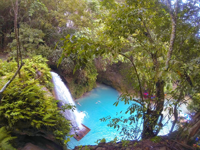 Kawasan heading to upper levels looking down on blue water pool