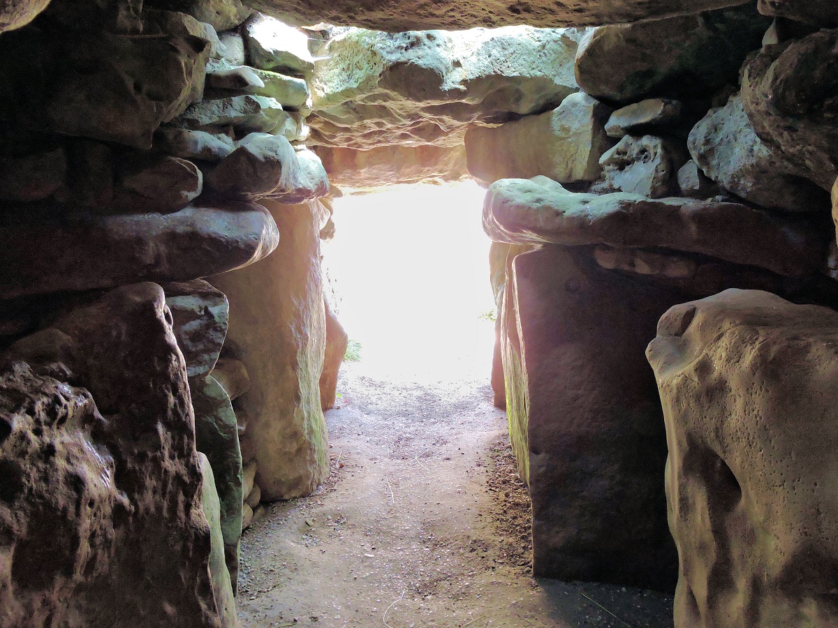 inside stone neolithic tomb looking out