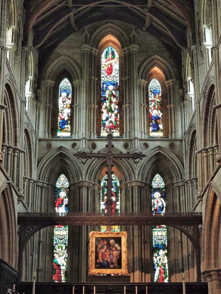 stained glass windows and altar cross