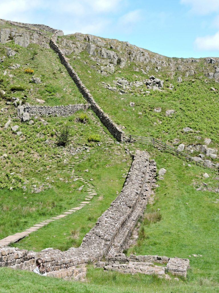 hadrian's wall ruins going up steep incline