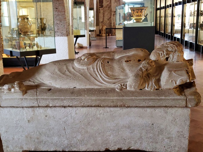 museum display cases and sarcophagus