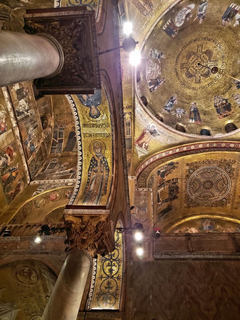 looking up at ceiling with gold mosaics