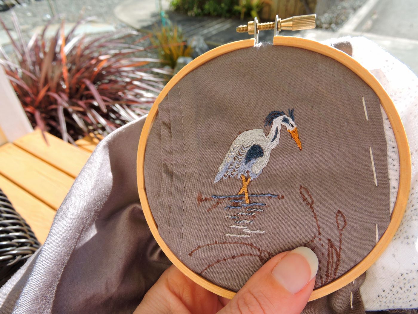 embroidery hoop with blue heron egret stitched