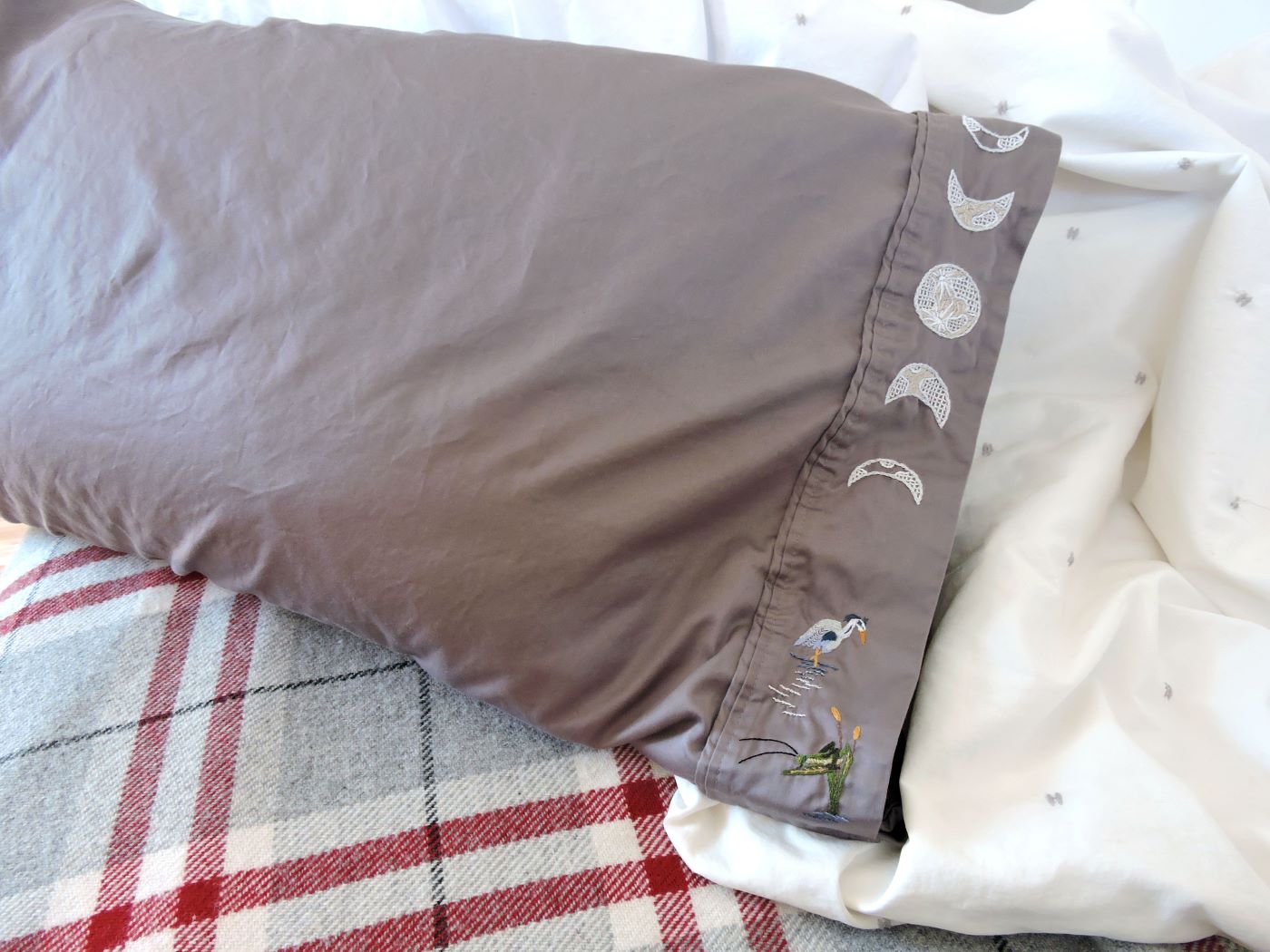 grey pillow case with moon phases and egret and cricket embroidery