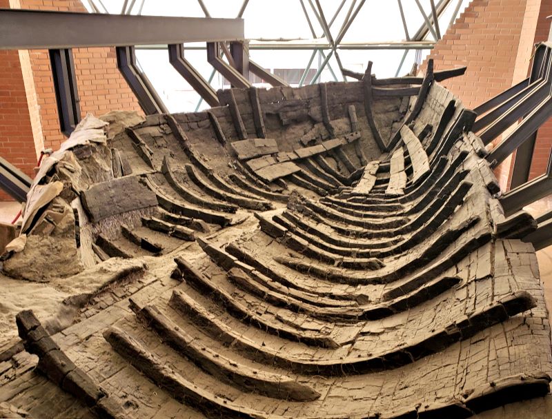 what remains of a wooden boat uncovered from Herculaneum's ancient shoreline