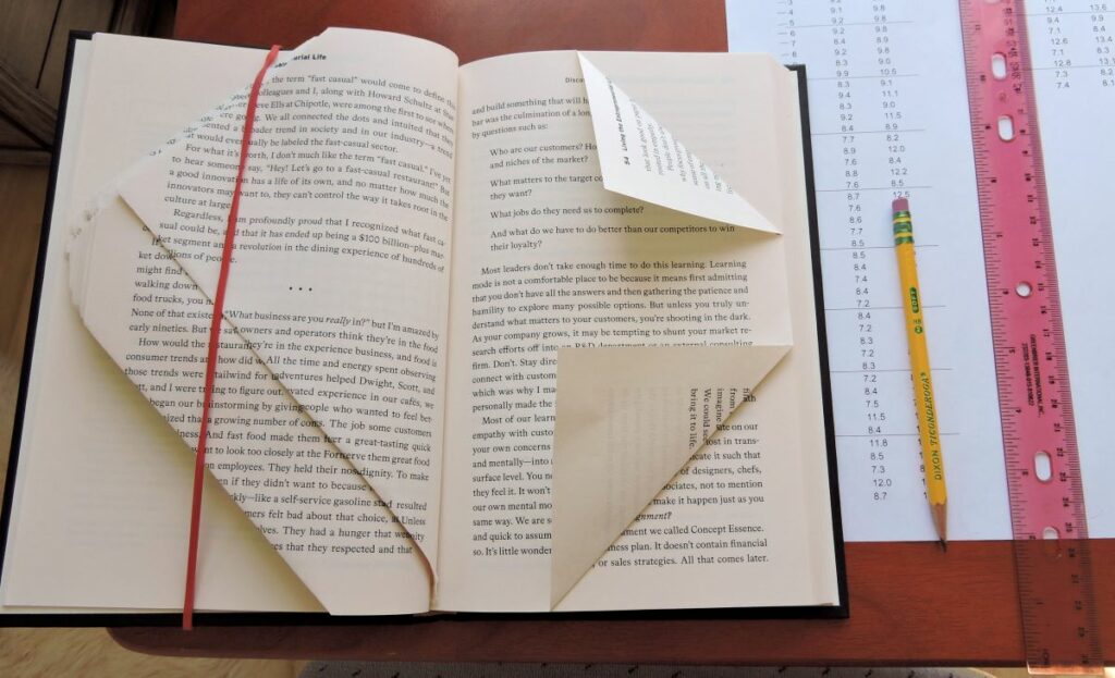 book with folded pages showing process of book art