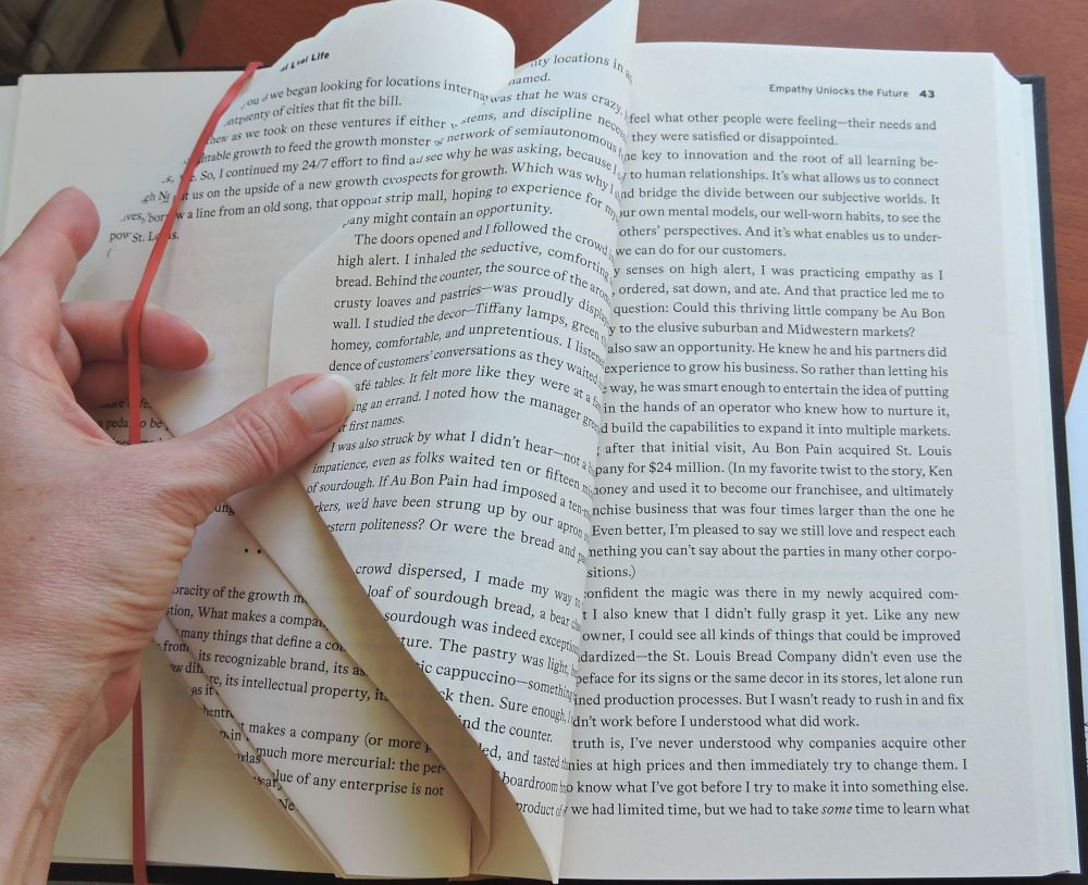 tucking folded pages under a big rubber band