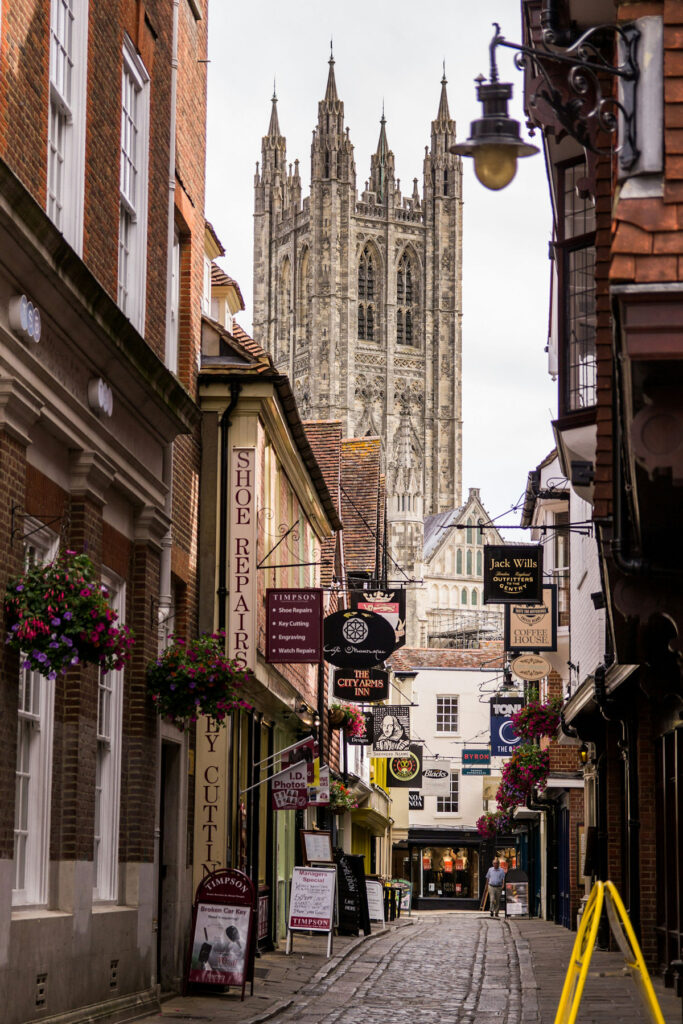 Canterbury cathedral rising above village shops