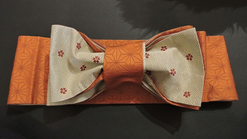 the fabric is tied in a bow