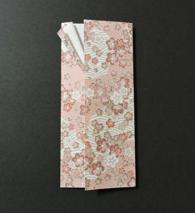 step four fold shown bring right side over to left