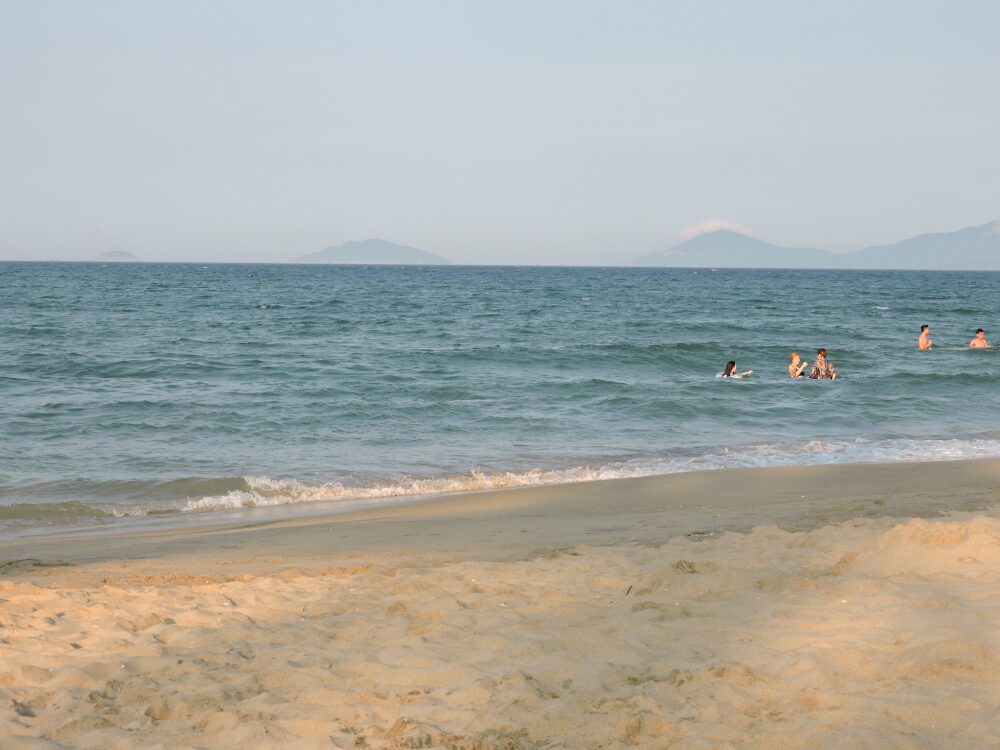 teal blue ocean and sandy beach