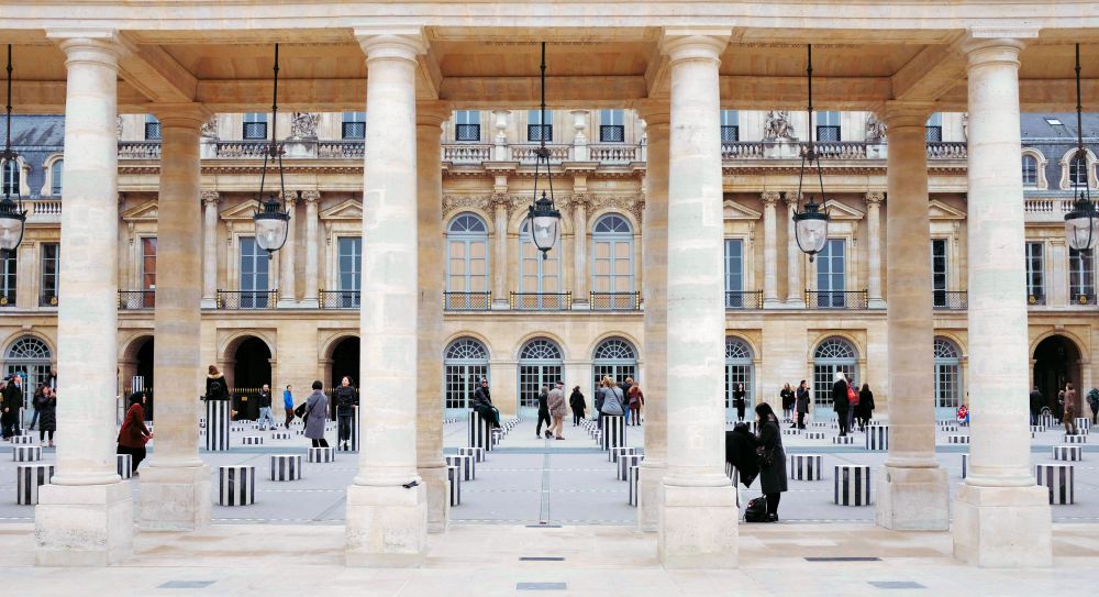 courtyard with striped black and white columns