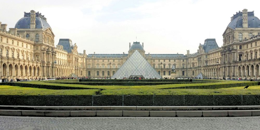 exterior of the Louvre museum with pyramid