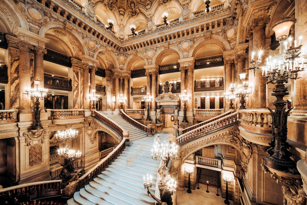 elaborate marble staircase with candelabra
