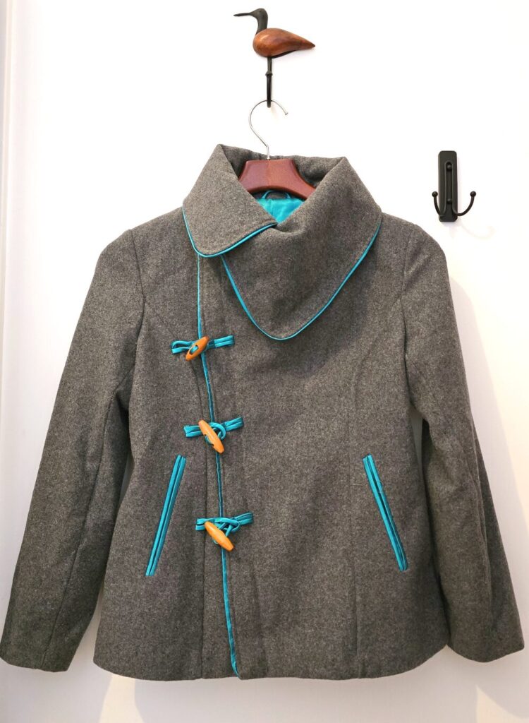 grey wool coat with toggle buttons and blue silk lining