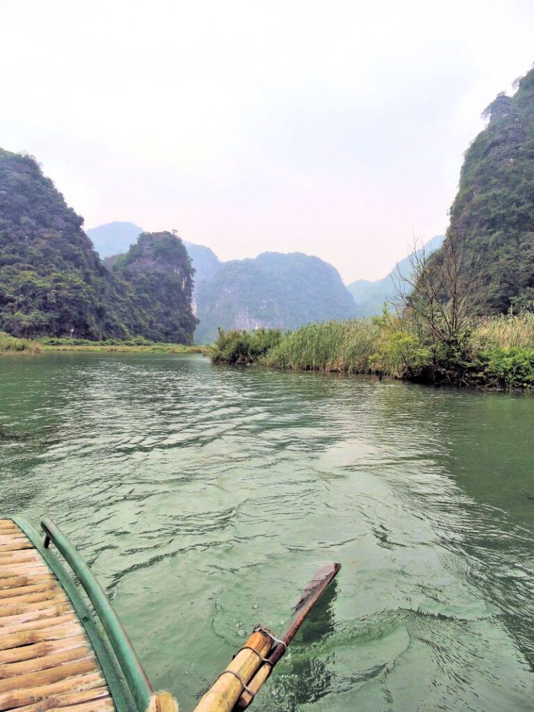 row boat on peaceful river through scenic countryside