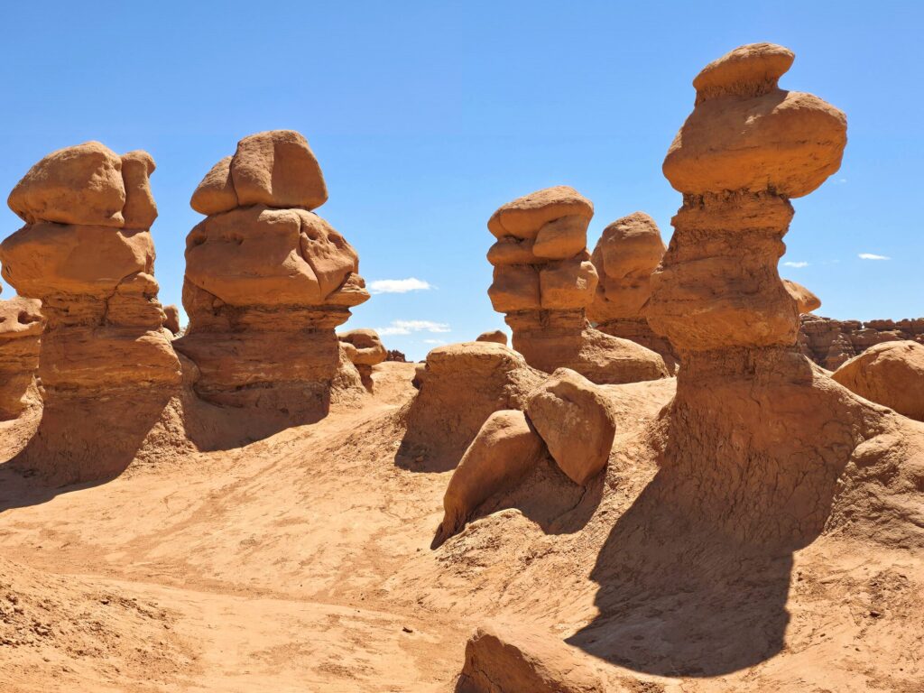 sandstone hoodoos rising up from the dessert